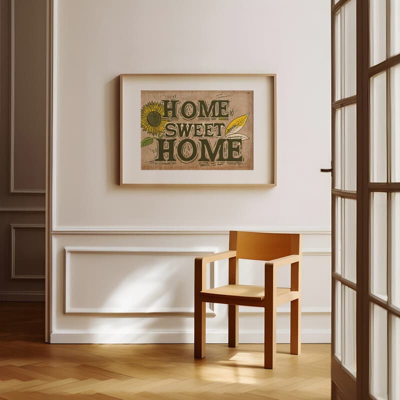 Room view with a matted frame of A vintage linocut print, the words "HOME SWEET HOME" with a sunflower