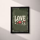 Full frame view of A vintage letterpress print, the word "LOVE" with hearts