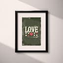 Matted frame view of A vintage letterpress print, the word "LOVE" with hearts