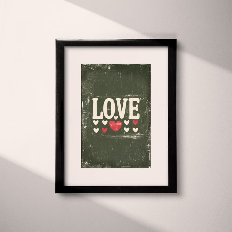 Matted frame view of A vintage letterpress print, the word "LOVE" with hearts