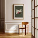 Room view with a matted frame of A vintage letterpress print, the word "LOVE" with hearts