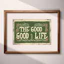 Matted frame view of A vintage linocut print, the words "THE GOOD GOOD LIFE" with a pattern