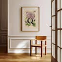 Room view with a matted frame of A vintage pastel pencil illustration, the letter "Q" with a flower