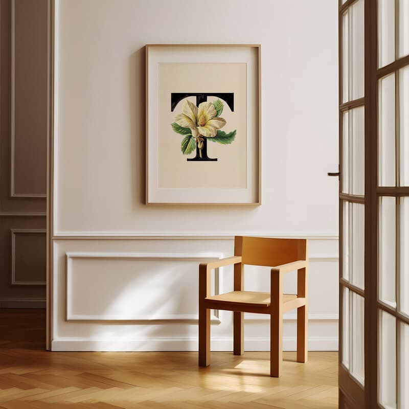 Room view with a matted frame of A vintage pastel pencil illustration, the letter "T" with a flower