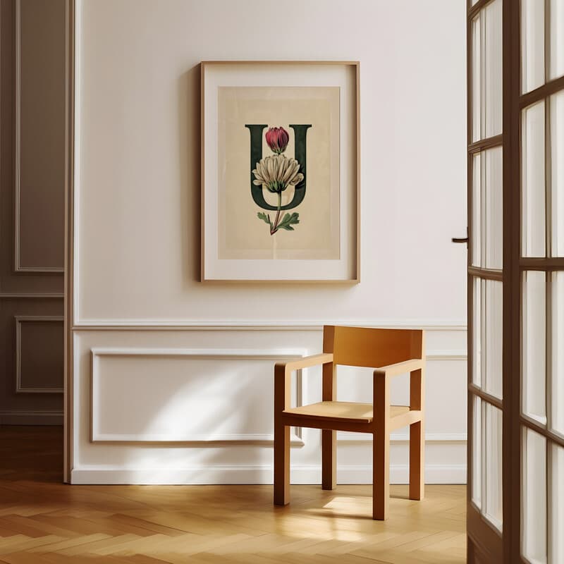 Room view with a matted frame of A vintage pastel pencil illustration, the letter "U" with a flower