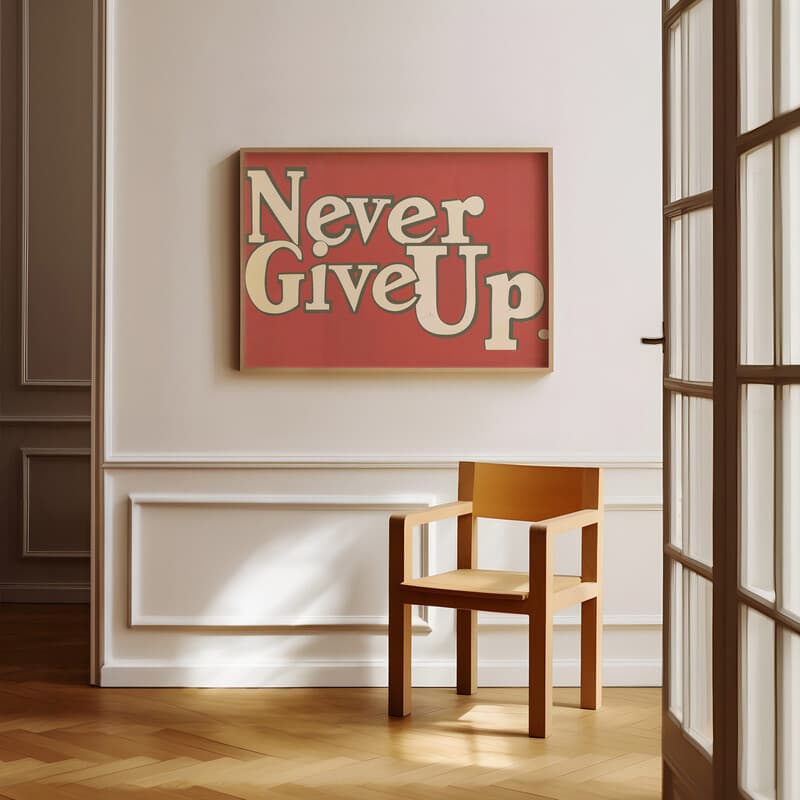 Room view with a full frame of A vintage linocut print, the words "Never Give Up" in cursive