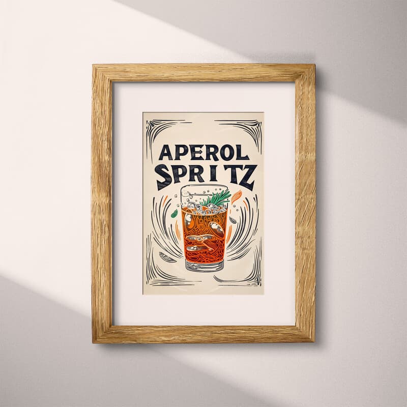 Matted frame view of A vintage linocut print, the words "APEROL SPRITZ" with a spritz coctail