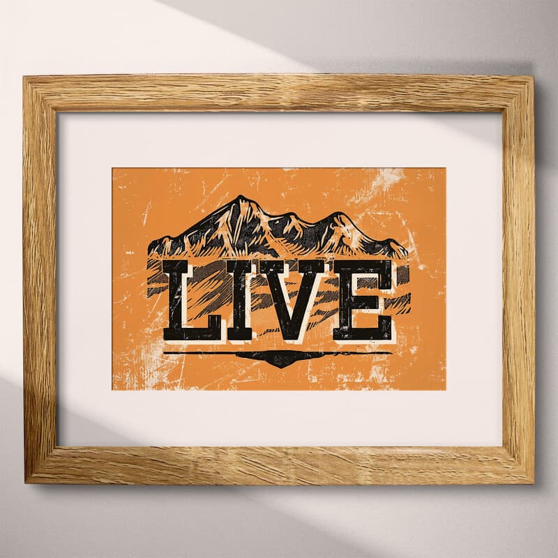 Matted frame view of A contemporary linocut print, the words "LIVE" with mountains