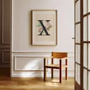 Room view with a matted frame of A vintage pastel pencil illustration, the letter "X" with a flower