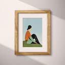 Matted frame view of An abstract vintage cartoon drawing, a woman sitting on the grass