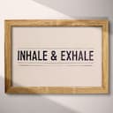 Full frame view of A contemporary letterpress print, the words "INHALE & EXHALE" with lines