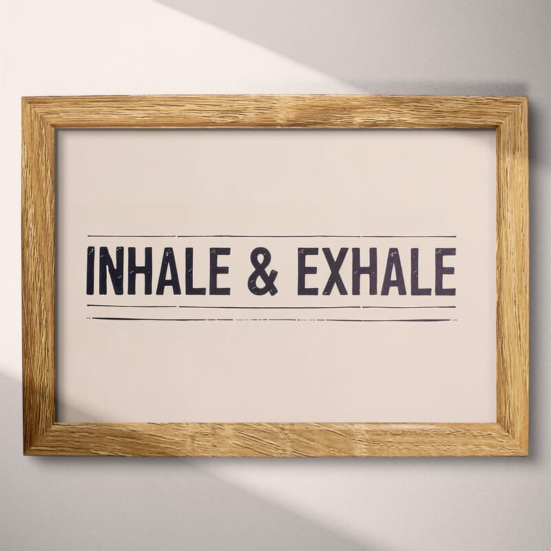 Full frame view of A contemporary letterpress print, the words "INHALE & EXHALE" with lines