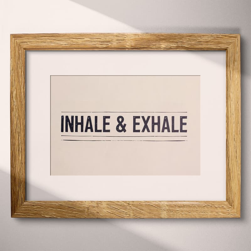 Matted frame view of A contemporary letterpress print, the words "INHALE & EXHALE" with lines