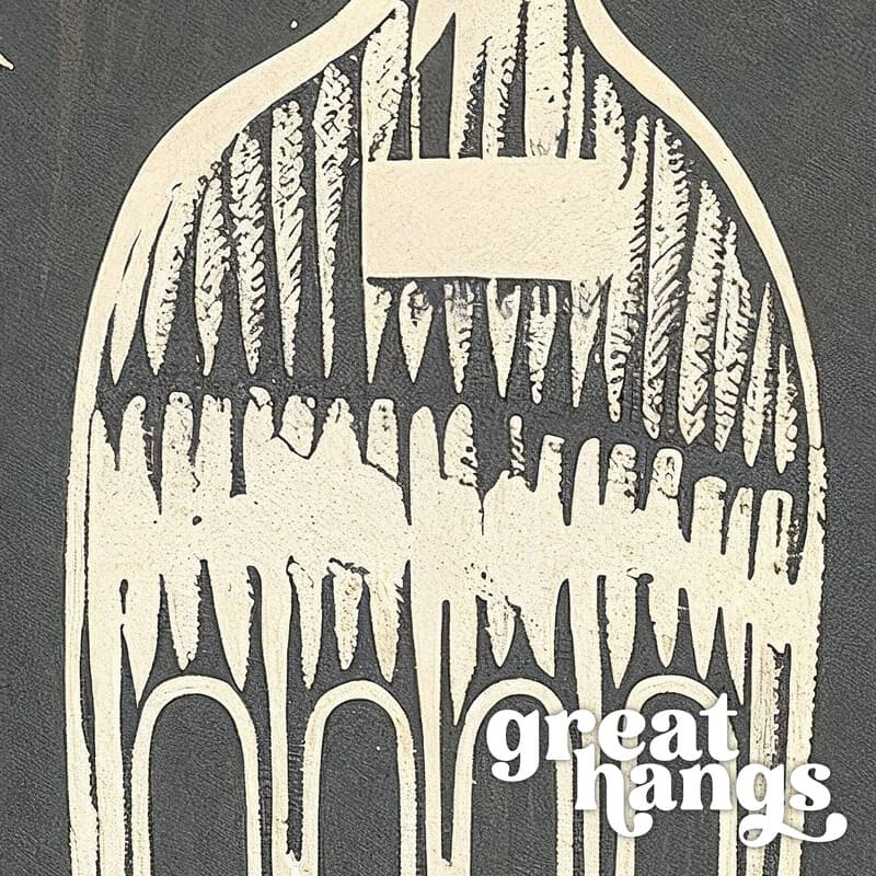 Closeup view of A vintage linocut print, the words "FORK THAT" with a fork