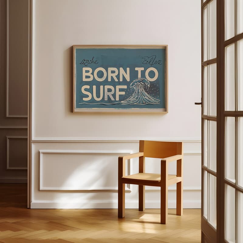 Room view with a full frame of A vintage linocut print, the words "BORN TO SURF" with a wave