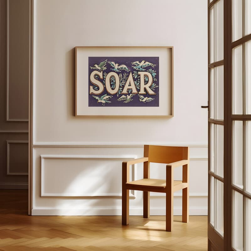 Room view with a matted frame of A vintage linocut print, the word "SOAR" with birds