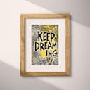 Matted frame view of A vintage linocut print, the words "KEEP DREAMING" with a whimsical pattern