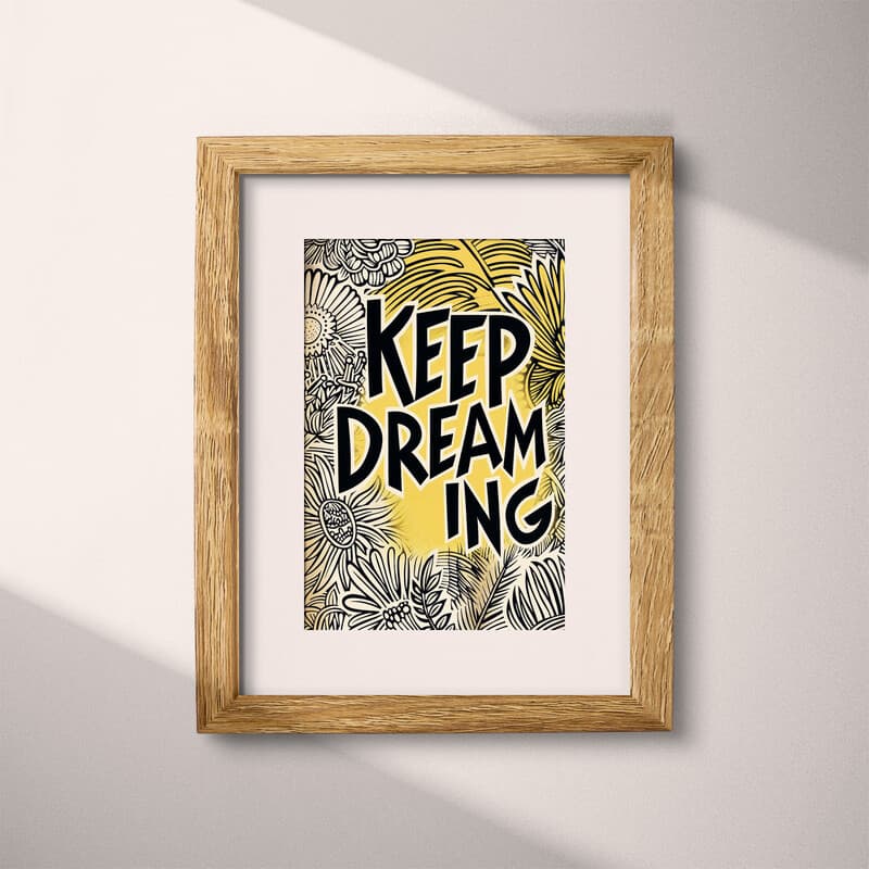 Matted frame view of A vintage linocut print, the words "KEEP DREAMING" with a whimsical pattern