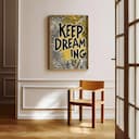 Room view with a full frame of A vintage linocut print, the words "KEEP DREAMING" with a whimsical pattern