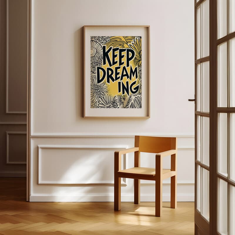 Room view with a matted frame of A vintage linocut print, the words "KEEP DREAMING" with a whimsical pattern