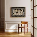 Room view with a full frame of A vintage linocut print, the words "EMBRACE CHANGE"