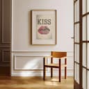 Room view with a matted frame of A vintage linocut print, the word "KISS" with a set of lips