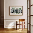 Room view with a full frame of A vintage linocut print, the word "FAMILY" with plants