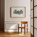 Room view with a matted frame of A vintage linocut print, the word "FAMILY" with plants