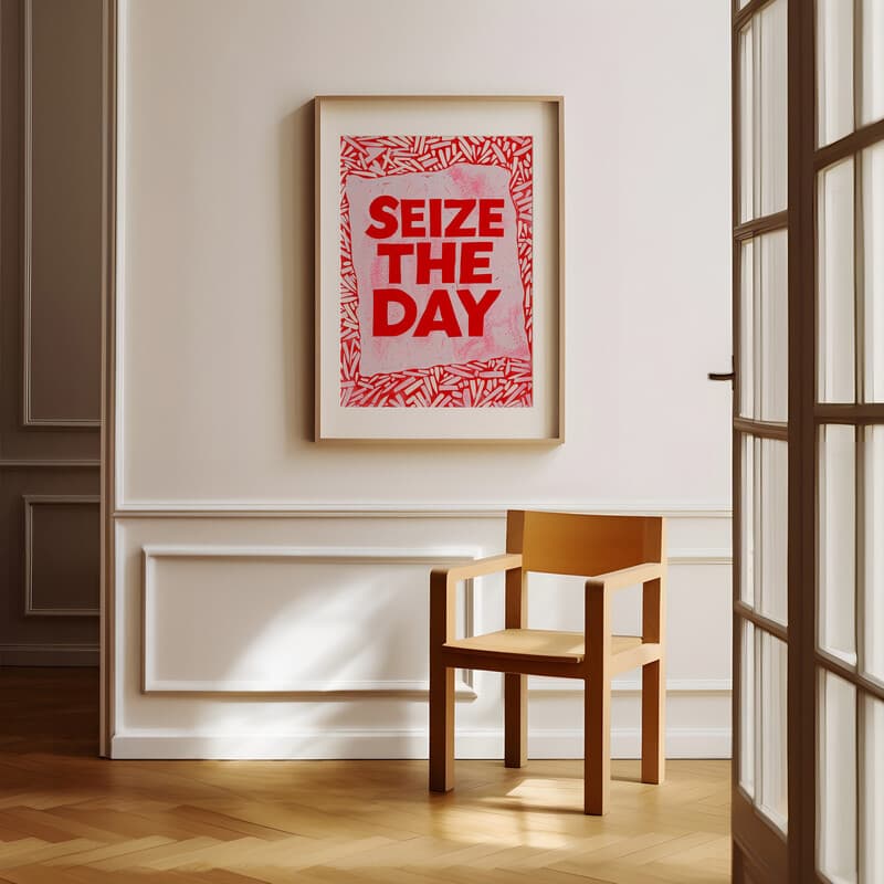 Room view with a matted frame of A minimalist linocut print, the words "SEIZE THE DAY"