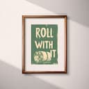 Matted frame view of A vintage linocut print, the words "ROLL WITH IT" with a roll of toilet paper